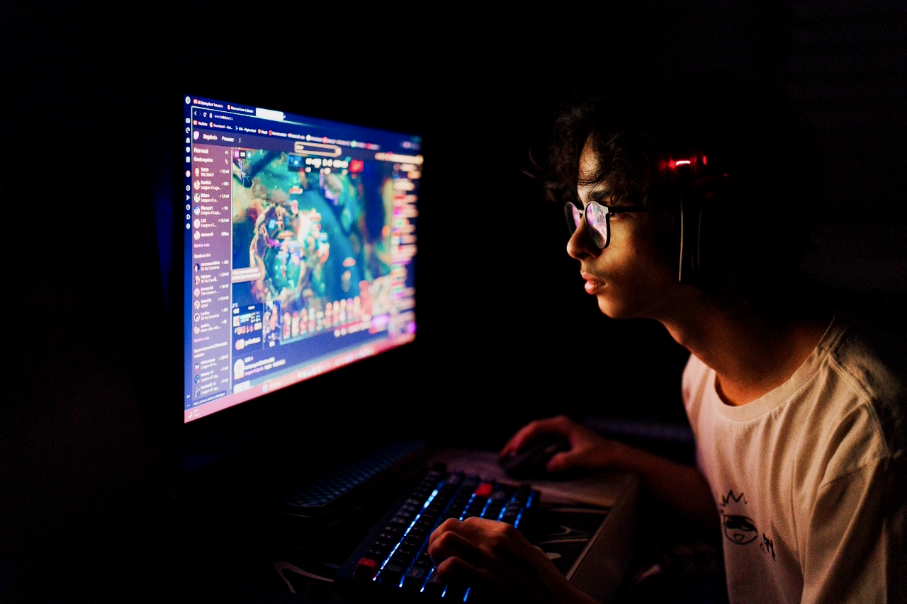 Twitch moderator monitoring a live chat stream at their desk.